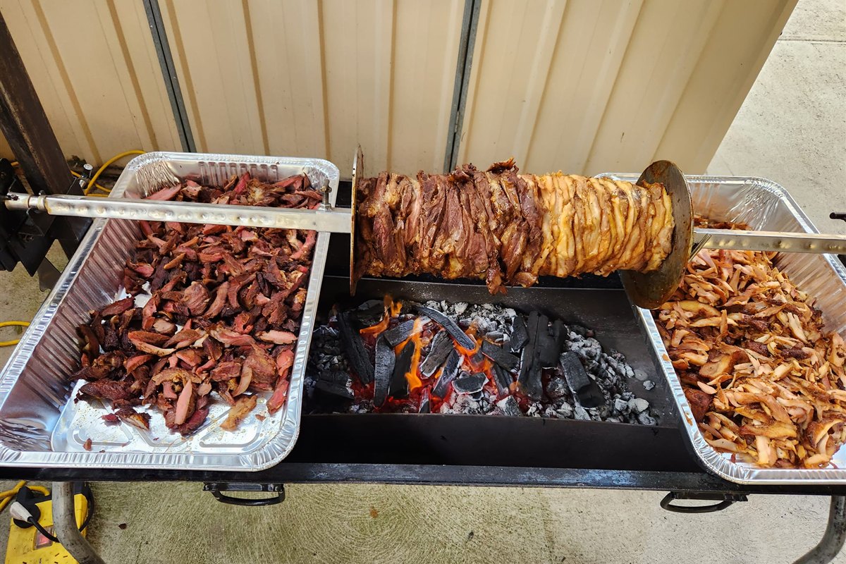Spit-roasted meats with freshly carved portions ready to serve